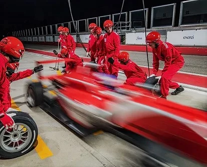 A race car stopping at a stand during the British Grand Prix