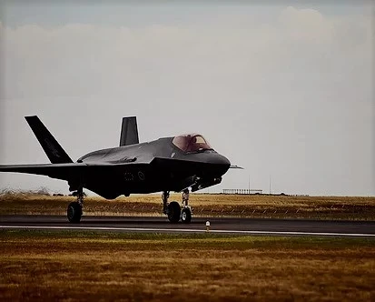 A military plane landing on the base